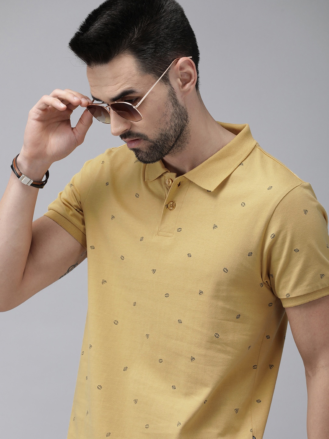 

The Roadster Lifestyle Co Men Yellow Printed Pure Cotton Polo Collar T-shirt