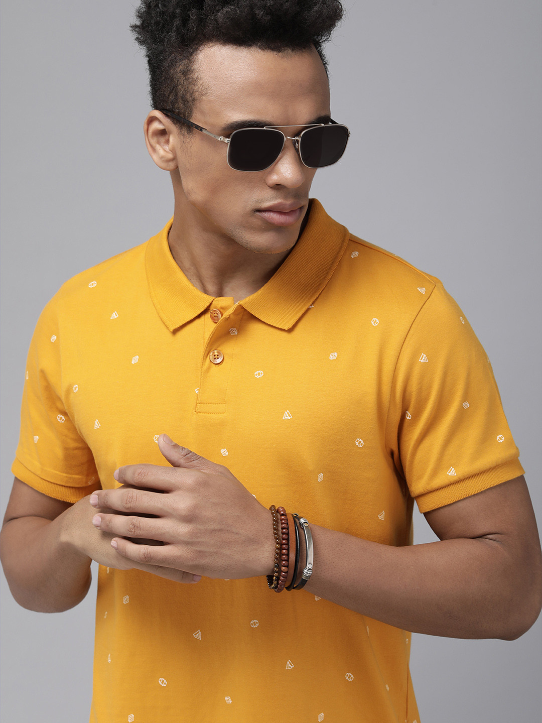 

The Roadster Lifestyle Co Men Mustard Yellow Printed Polo Collar Pure Cotton T-shirt