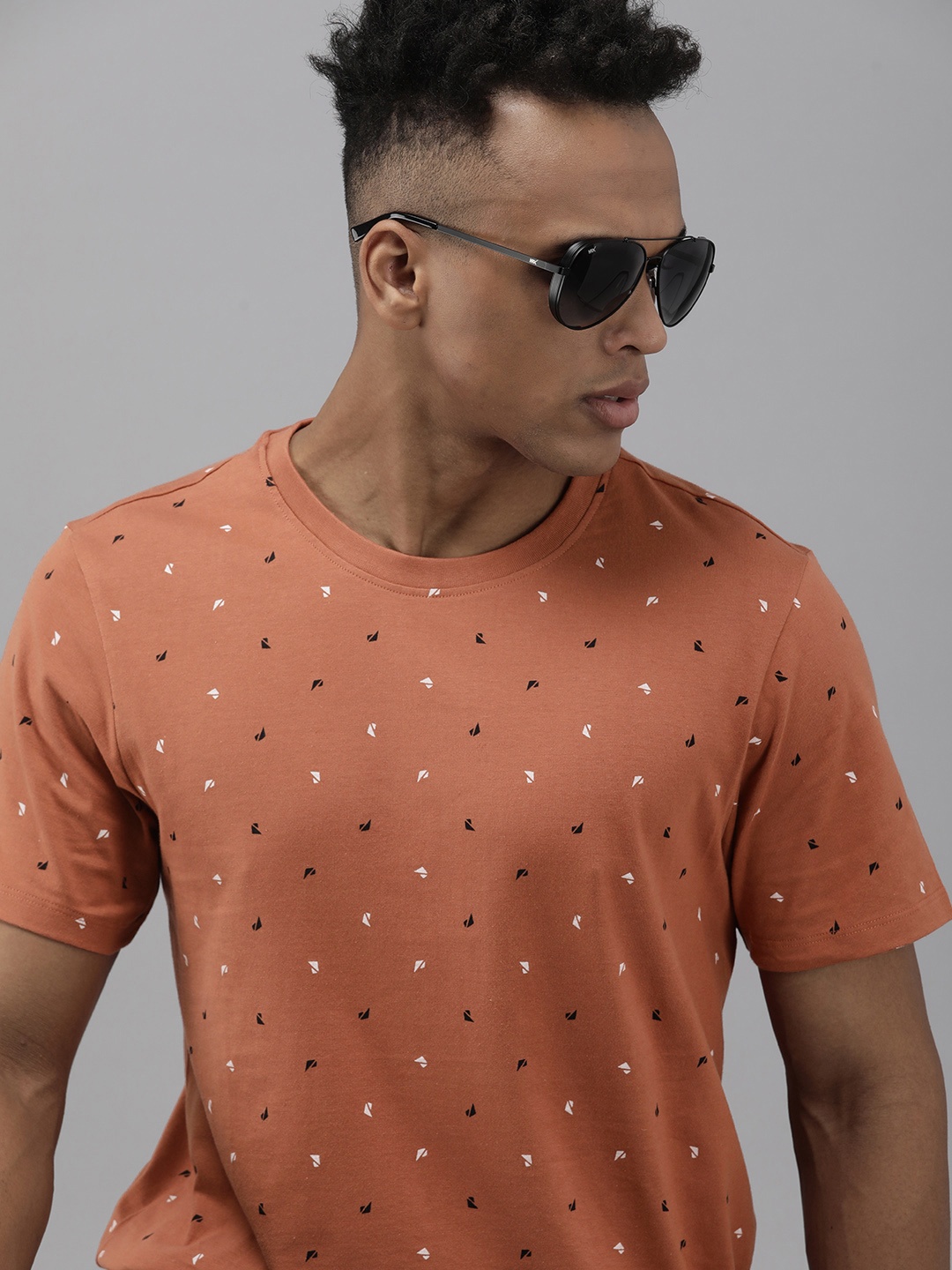 

The Roadster Lifestyle Co. Men Rust Printed Slim Fit Pure Cotton Casual T-shirt