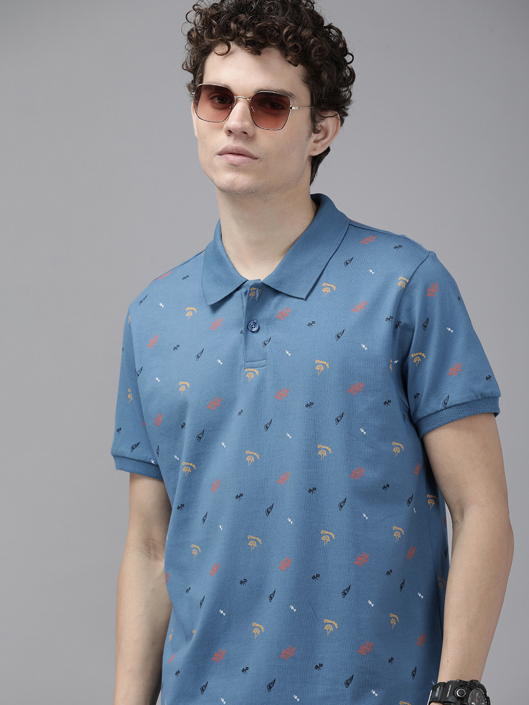 

The Roadster Lifestyle Co Men Blue & Yellow Biker Printed Polo Collar Pure Cotton T-shirt