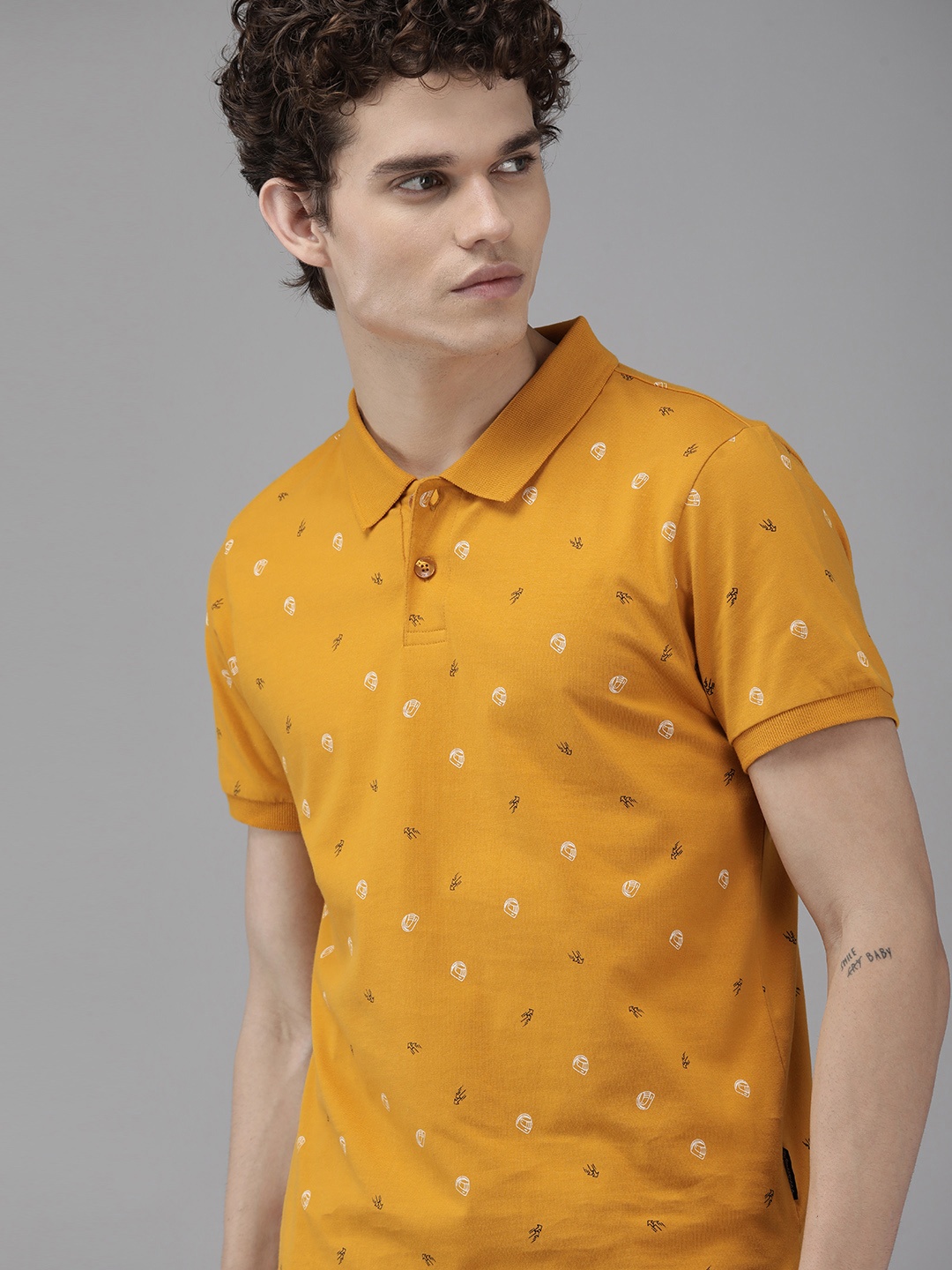 

Roadster Men Mustard Yellow & White Printed Polo Collar T-shirt