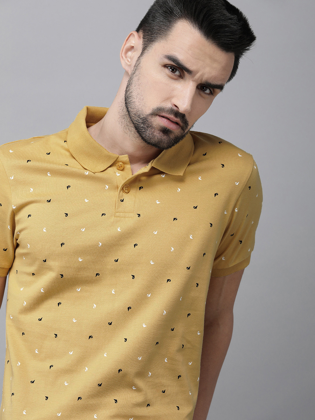 

The Roadster Lifestyle Co Men Yellow & Black Printed Polo Collar Pure Cotton T-shirt