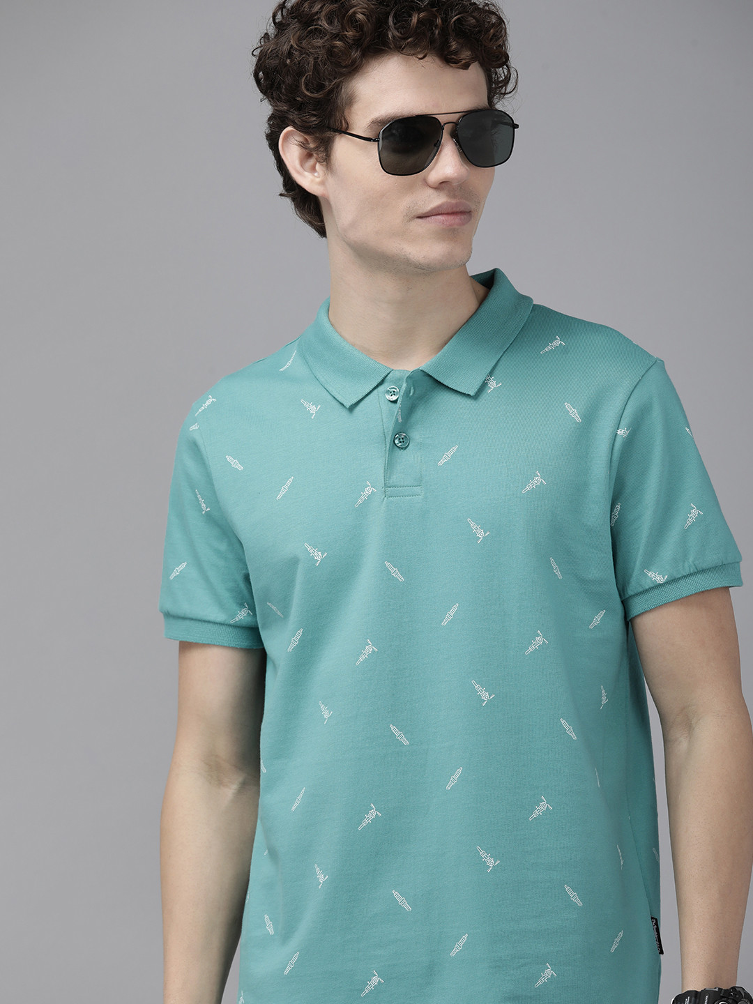 

The Roadster Lifestyle Co Men Teal Green Biker Printed Polo Collar Pure Cotton T-shirt