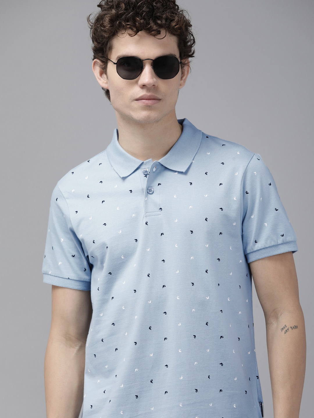 

The Roadster Lifestyle Co Men Blue & White Printed Polo Collar Pure Cotton T-shirt