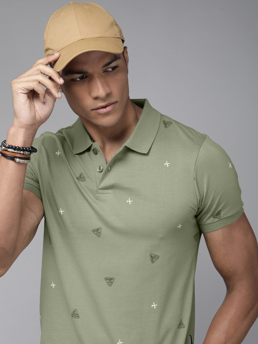 

The Roadster Lifestyle Co Men Olive Green & White Printed Pure Cotton Polo Collar T-shirt