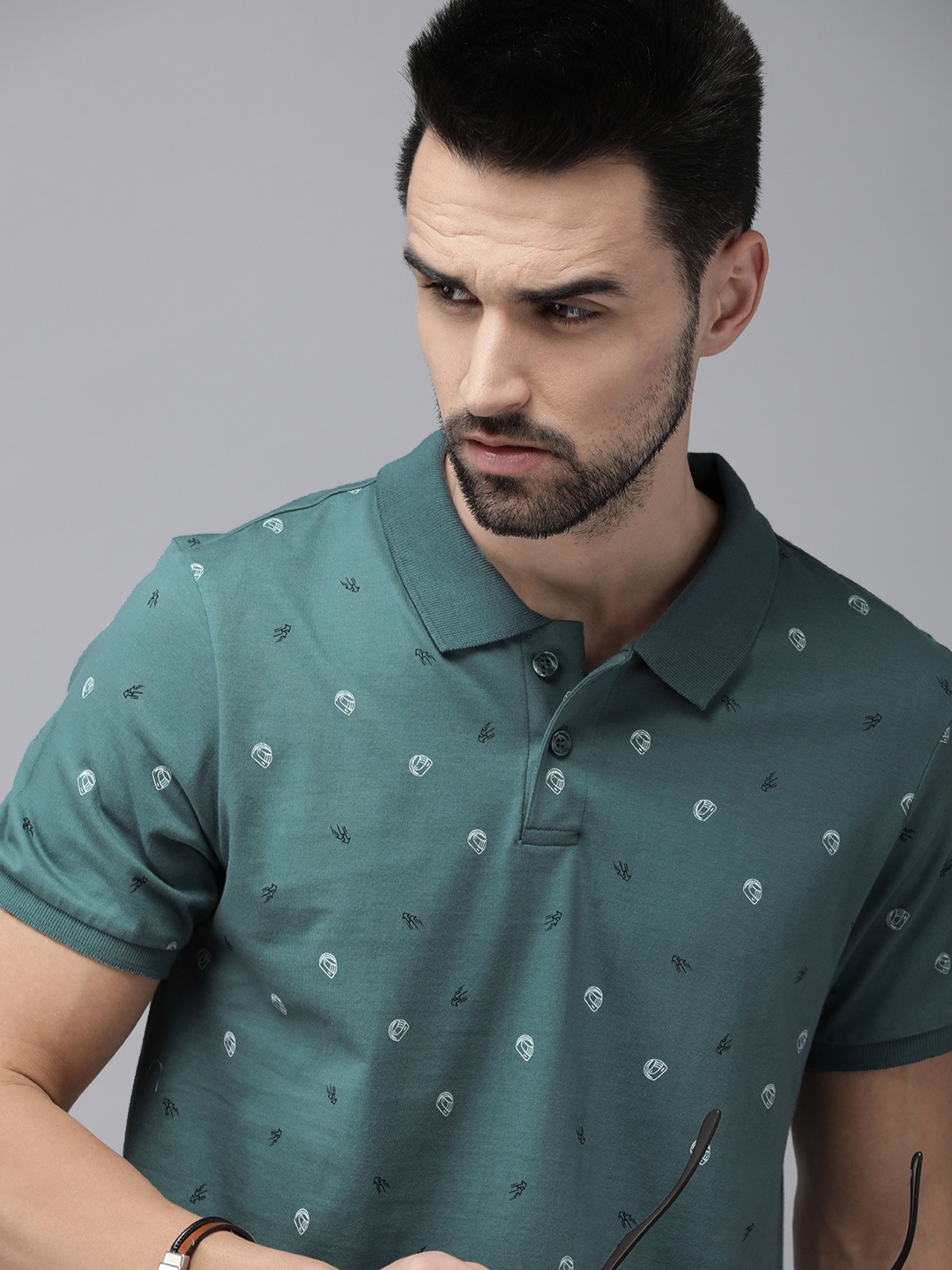 

The Roadster Lifestyle Co Men Green Printed Pure Cotton Polo Collar T-shirt