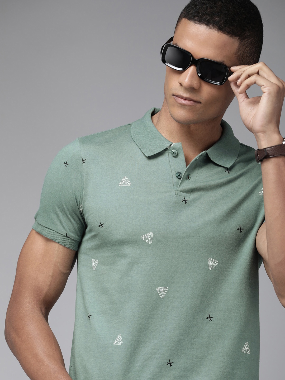 

The Roadster Lifestyle Co Men Green Printed Pure Cotton Polo Collar T-shirt