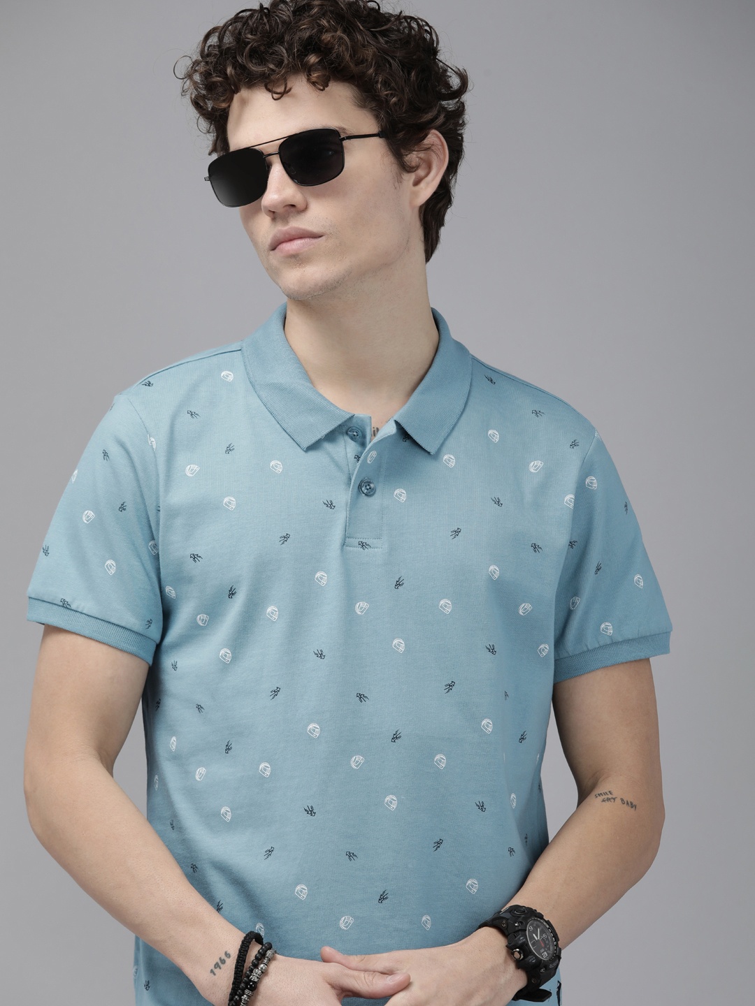 

The Roadster Lifestyle Co Men Blue & White Biker Printed Polo Collar Pure Cotton T-shirt