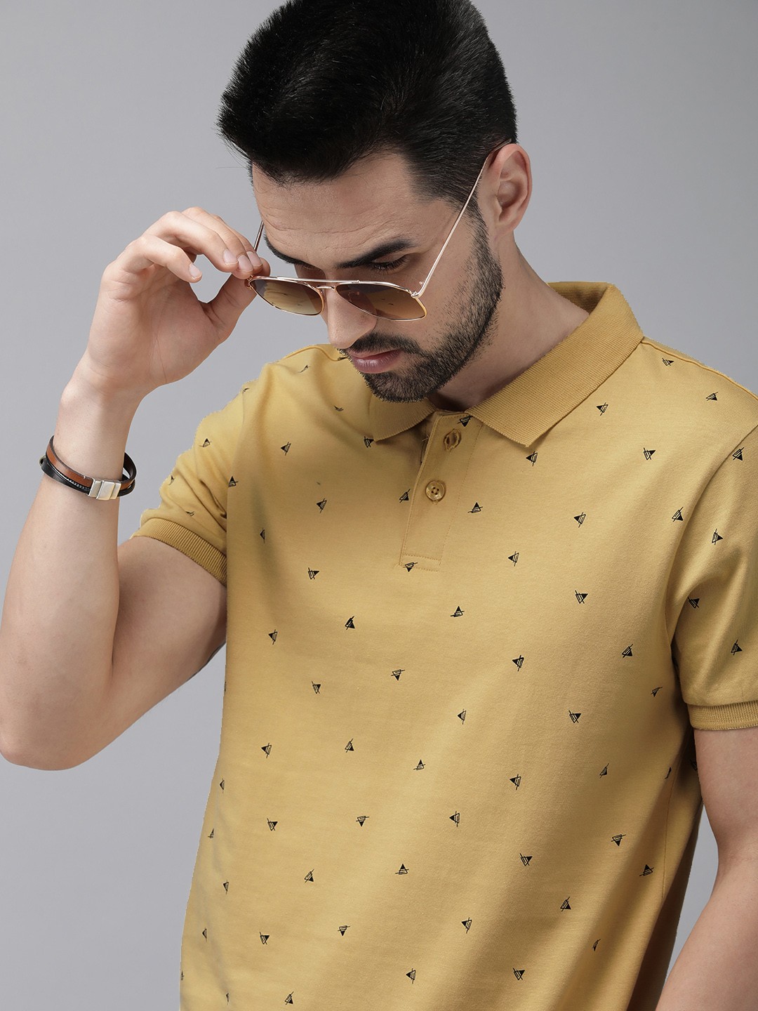 

The Roadster Lifestyle Co Men Yellow Printed Pure Cotton Polo Collar T-shirt