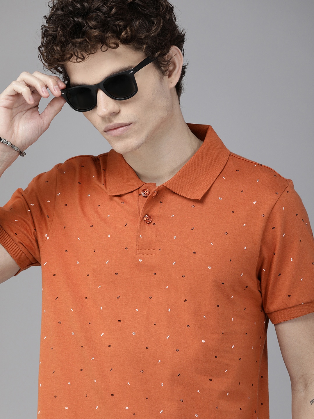 

The Roadster Lifestyle Co Men Rust Orange Printed Pure Cotton Polo Collar T-shirt