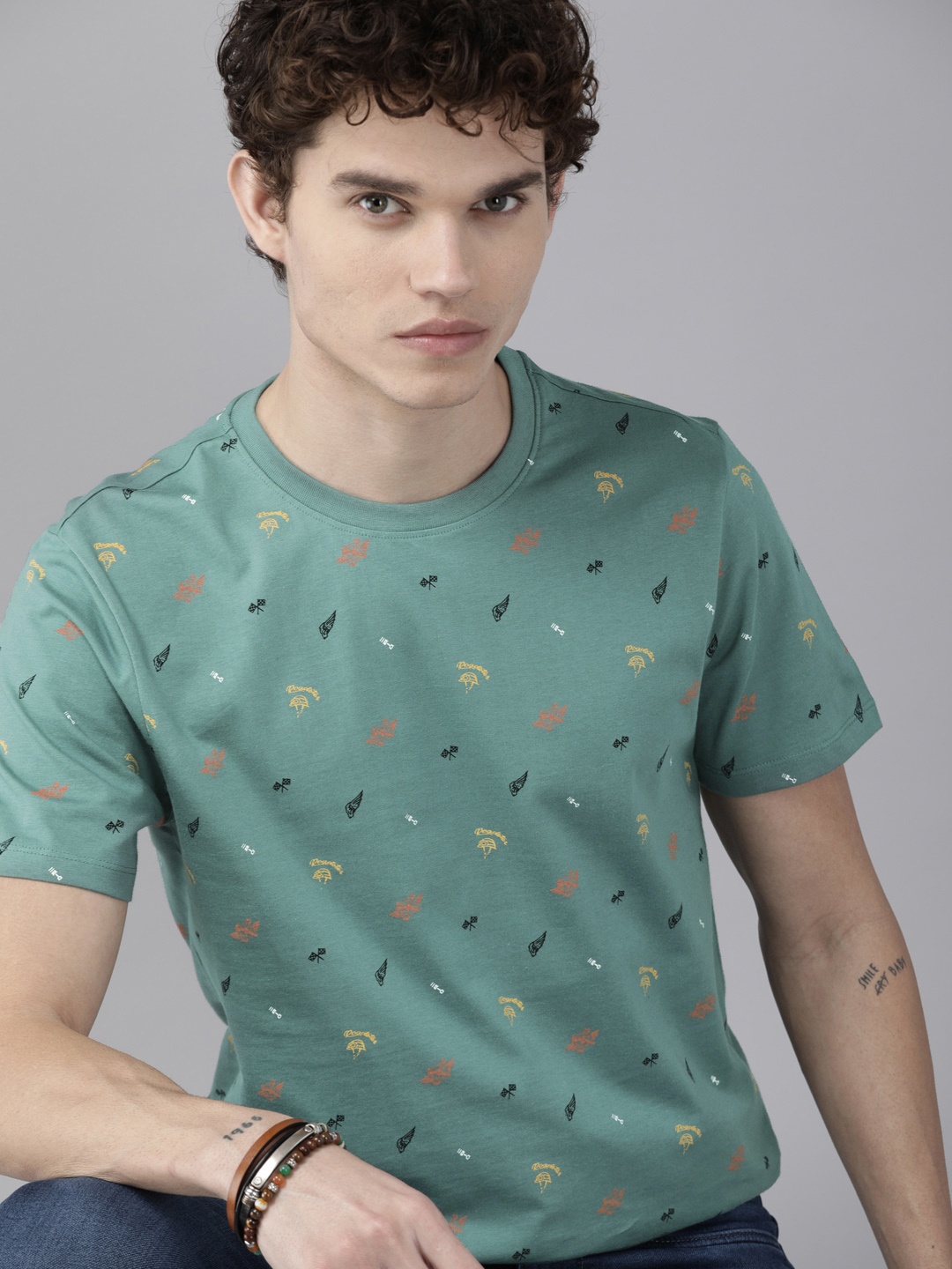

Roadster Men Sea Green & Orange Printed Round Neck T-shirt