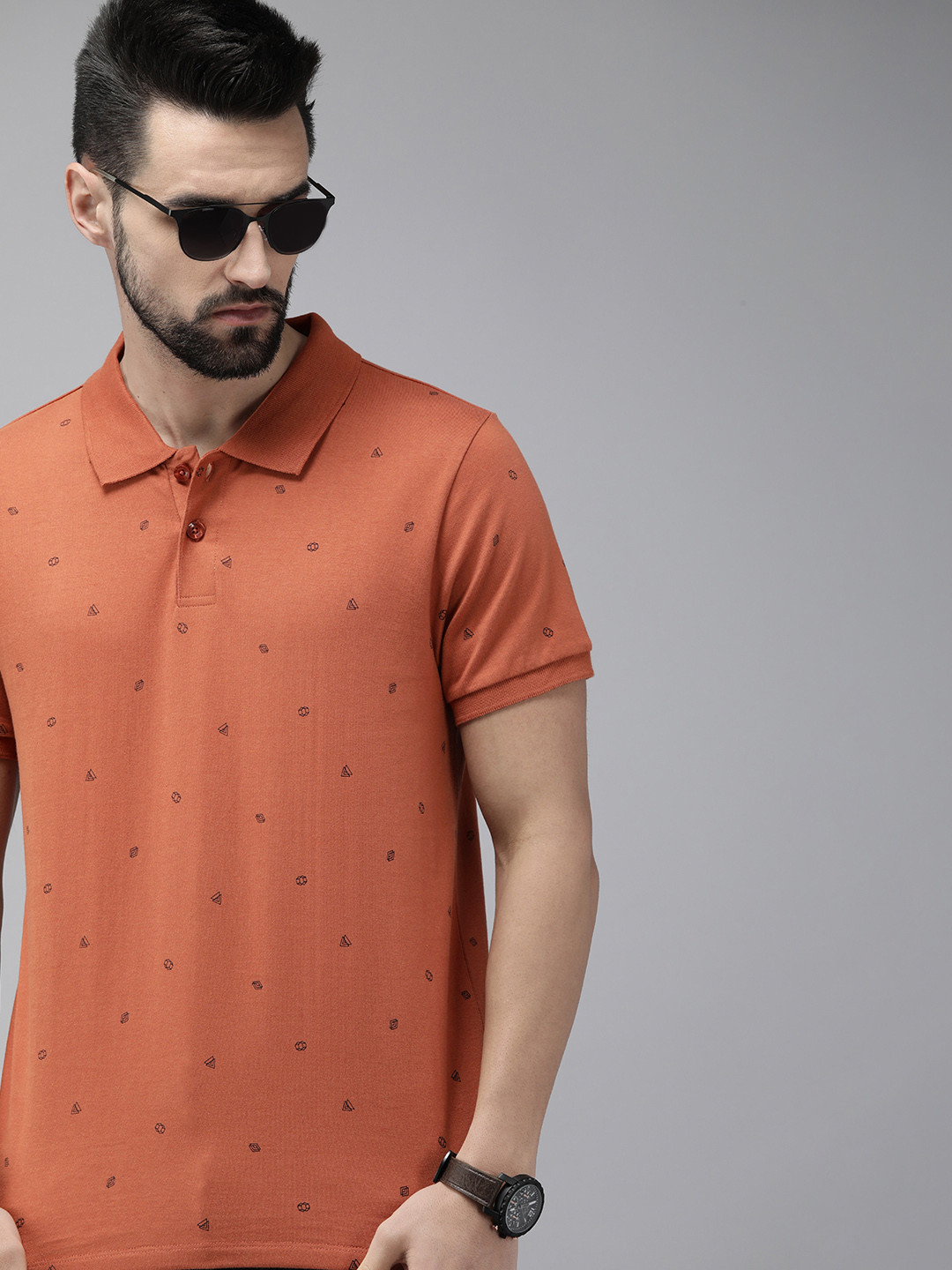 

The Roadster Lifestyle Co Men Rust Orange & Black Printed Polo Collar Pure Cotton T-shirt