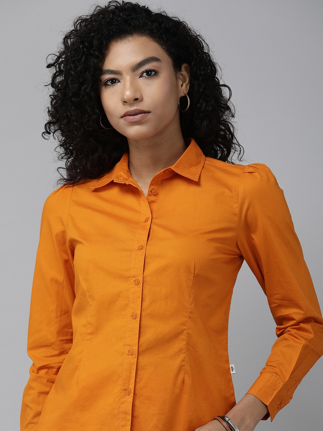 

The Roadster Lifestyle Co. Women Pure Cotton Solid Regular Fit Casual Shirt, Orange