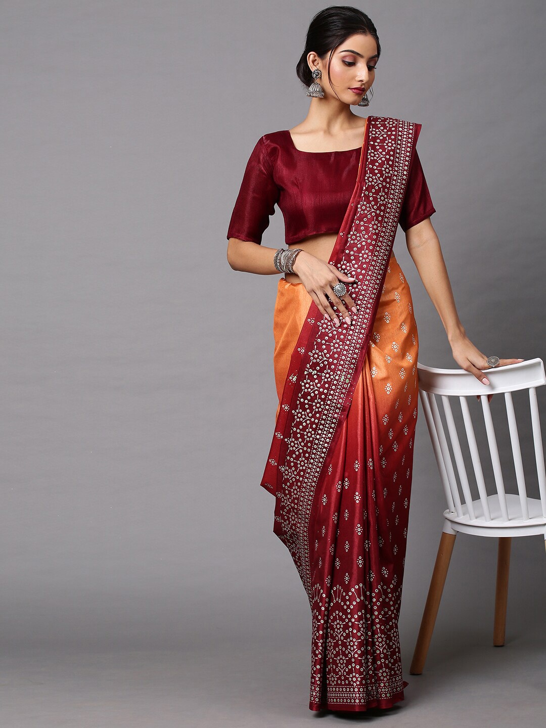 

Mitera Maroon & Orange Floral Silk Blend Bandhani Saree