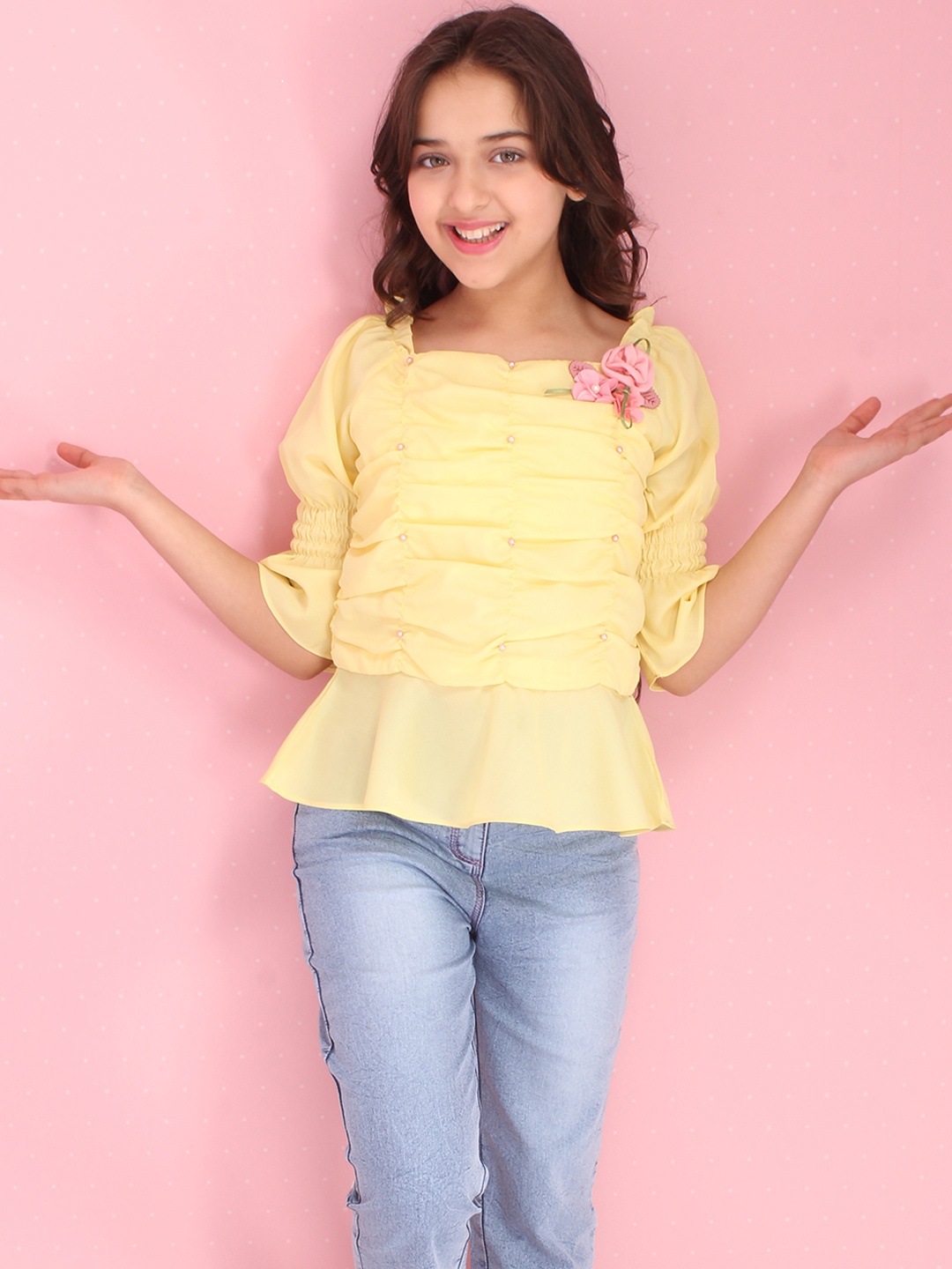 

CUTECUMBER Yellow Smocked Georgette Peplum Top