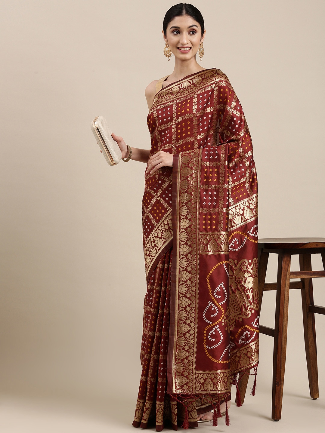 

Mitera Maroon & Golden Silk Blend Bandhani Saree
