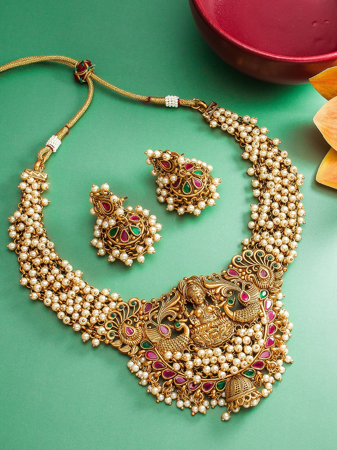 

aadita Women Gold Plated & White Pearl Temple Choker Jewellery Set