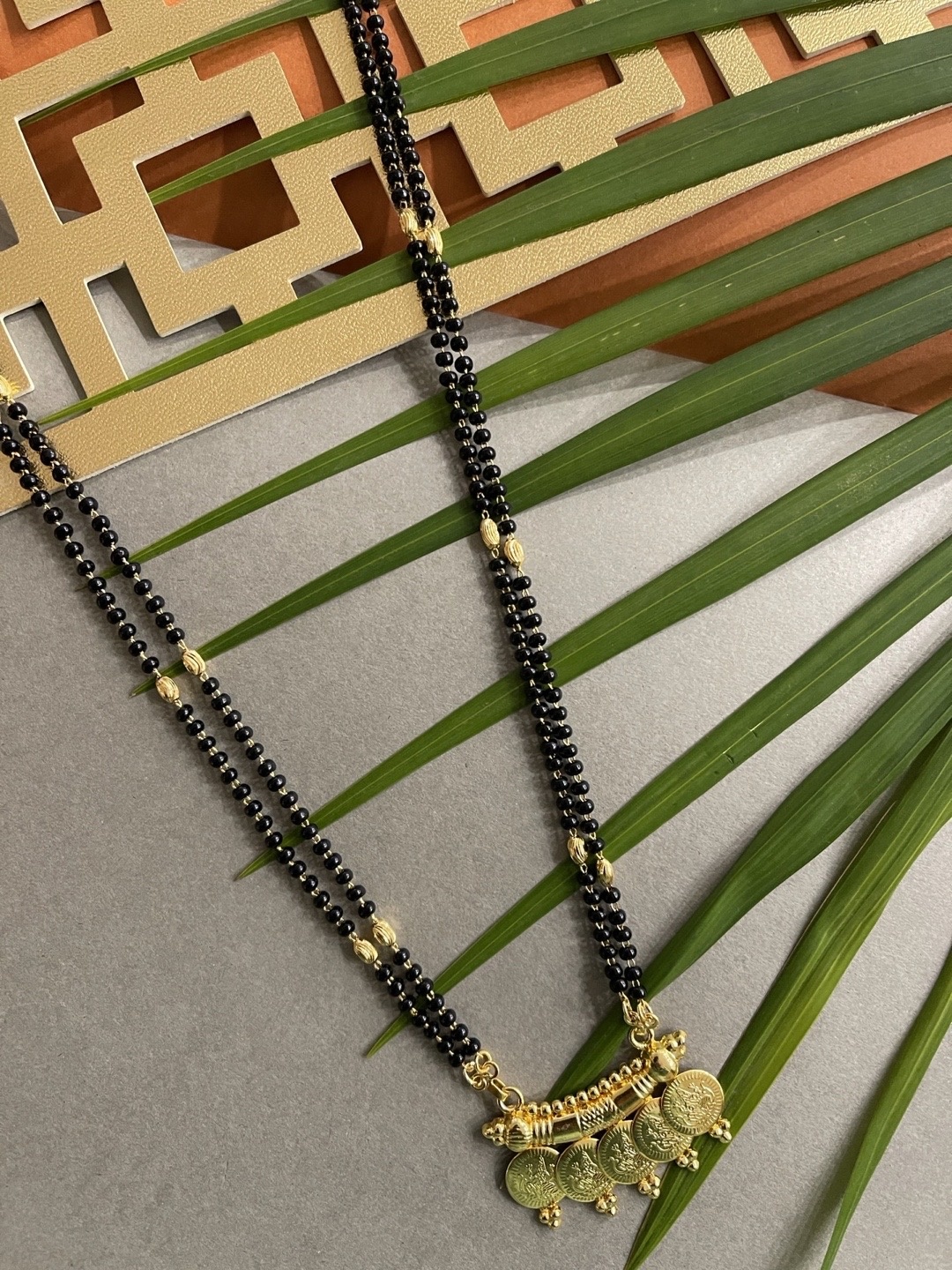 

Digital Dress Room Gold-Plated Black Beaded Lakshmi Coin Design Long Mangalsutra