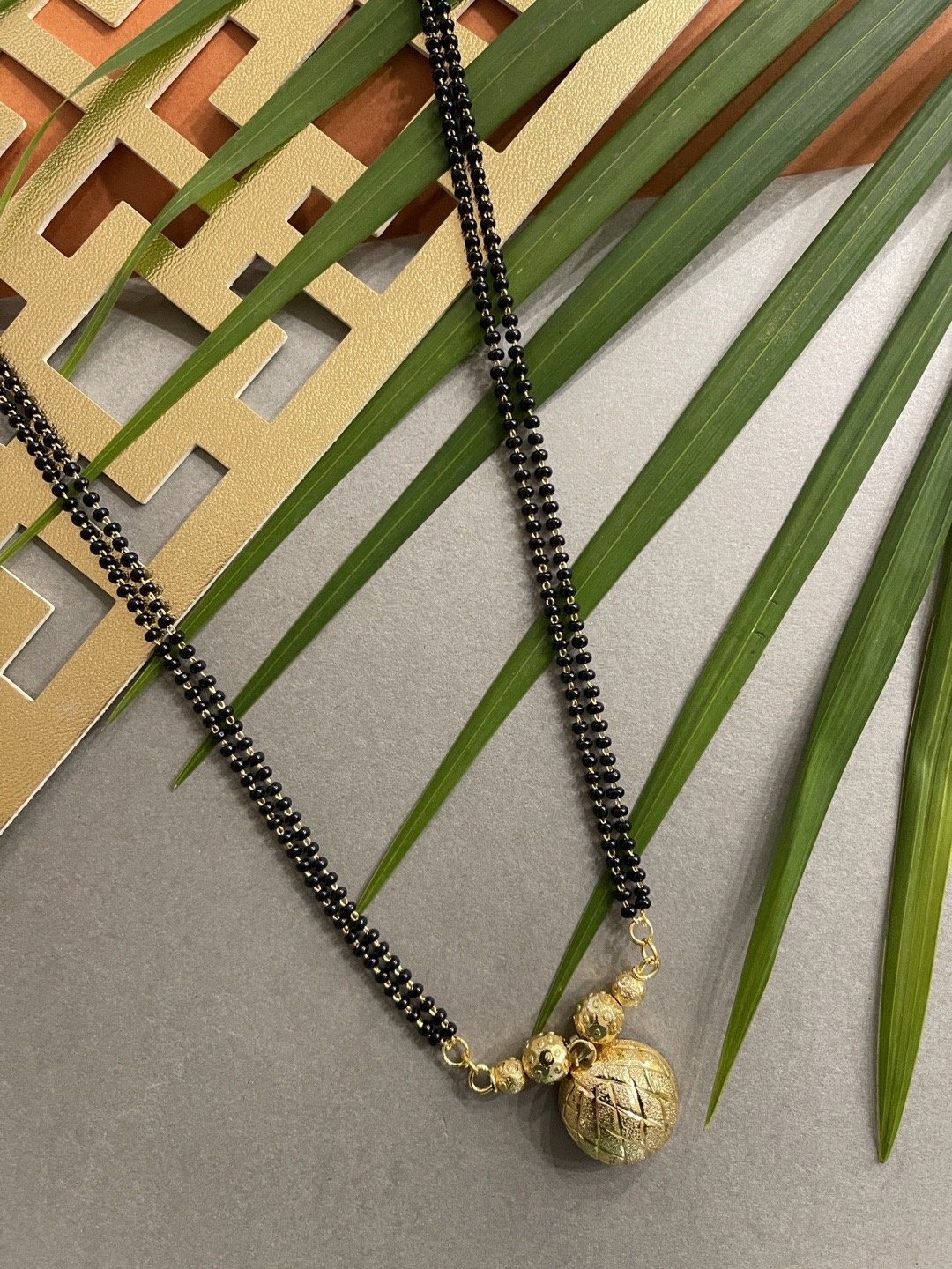 

Digital Dress Room Black Beaded Gold-Plated Maharashtrian Long Mangalsutra