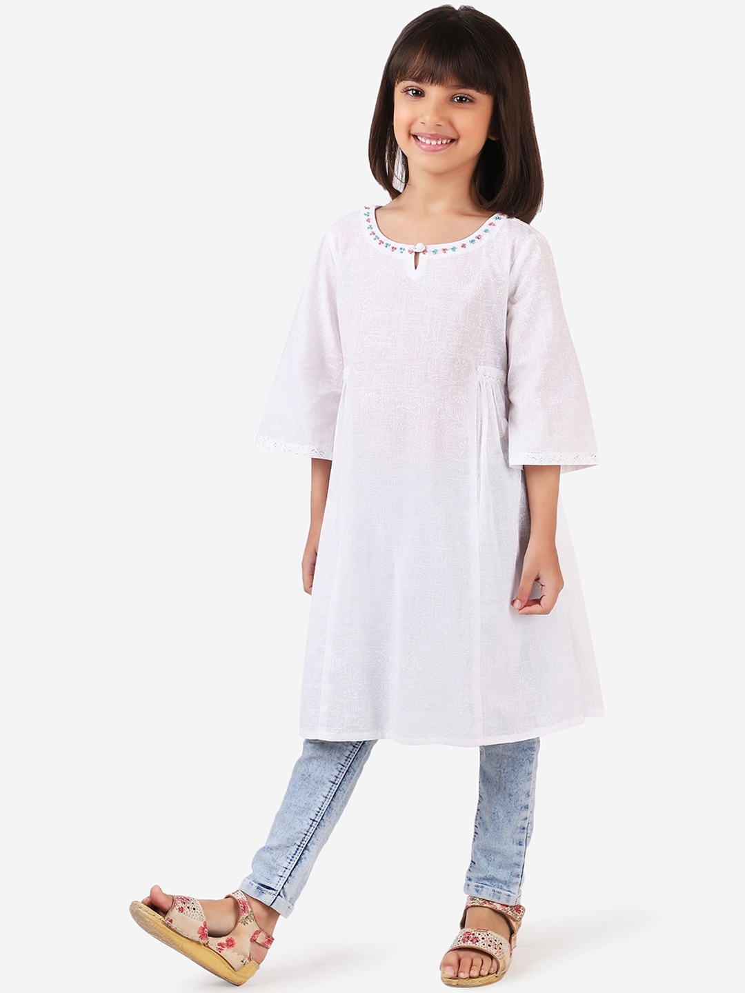 

Fabindia Girls White Floral Printed Flared Sleeves Thread Work Cotton Kurta