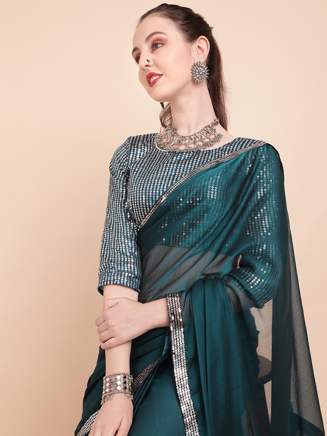 

Sangria Teal Green Sequinned Ruffled Pure Georgette Saree