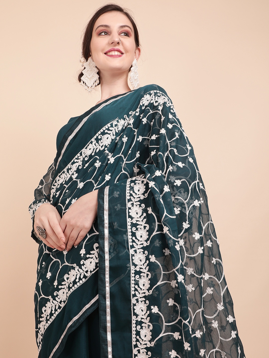 

Sangria Teal Green & White Ethnic Motifs Embroidered Pure Georgette Saree