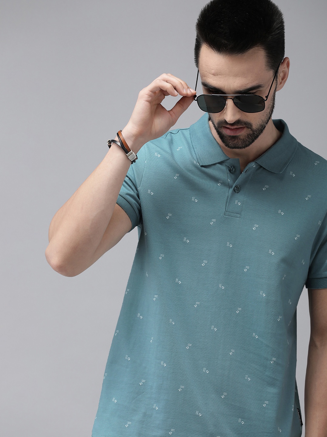 

The Roadster Lifestyle Co Men Sea Green Printed Pure Cotton Polo Collar T-shirt