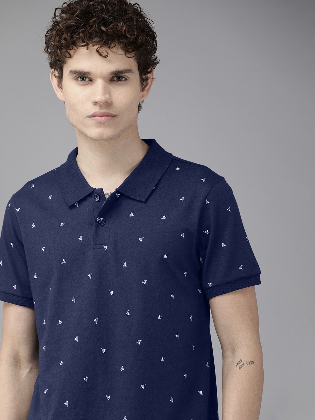 

The Roadster Lifestyle Co Men Navy Blue & White Printed Pure Cotton Polo Collar T-shirt