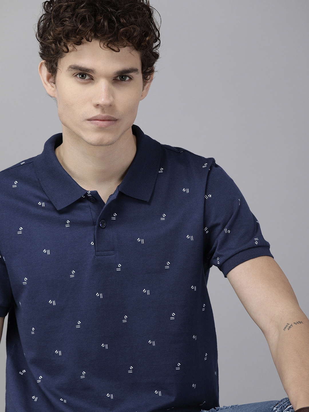 

The Roadster Lifestyle Co. Men Navy Blue & White Printed Pure Cotton Polo Collar T-shirt