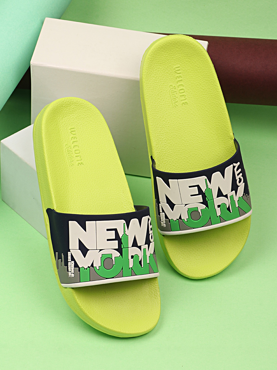 

WELCOME Boys Green & Blue Printed Sliders Flip Flops