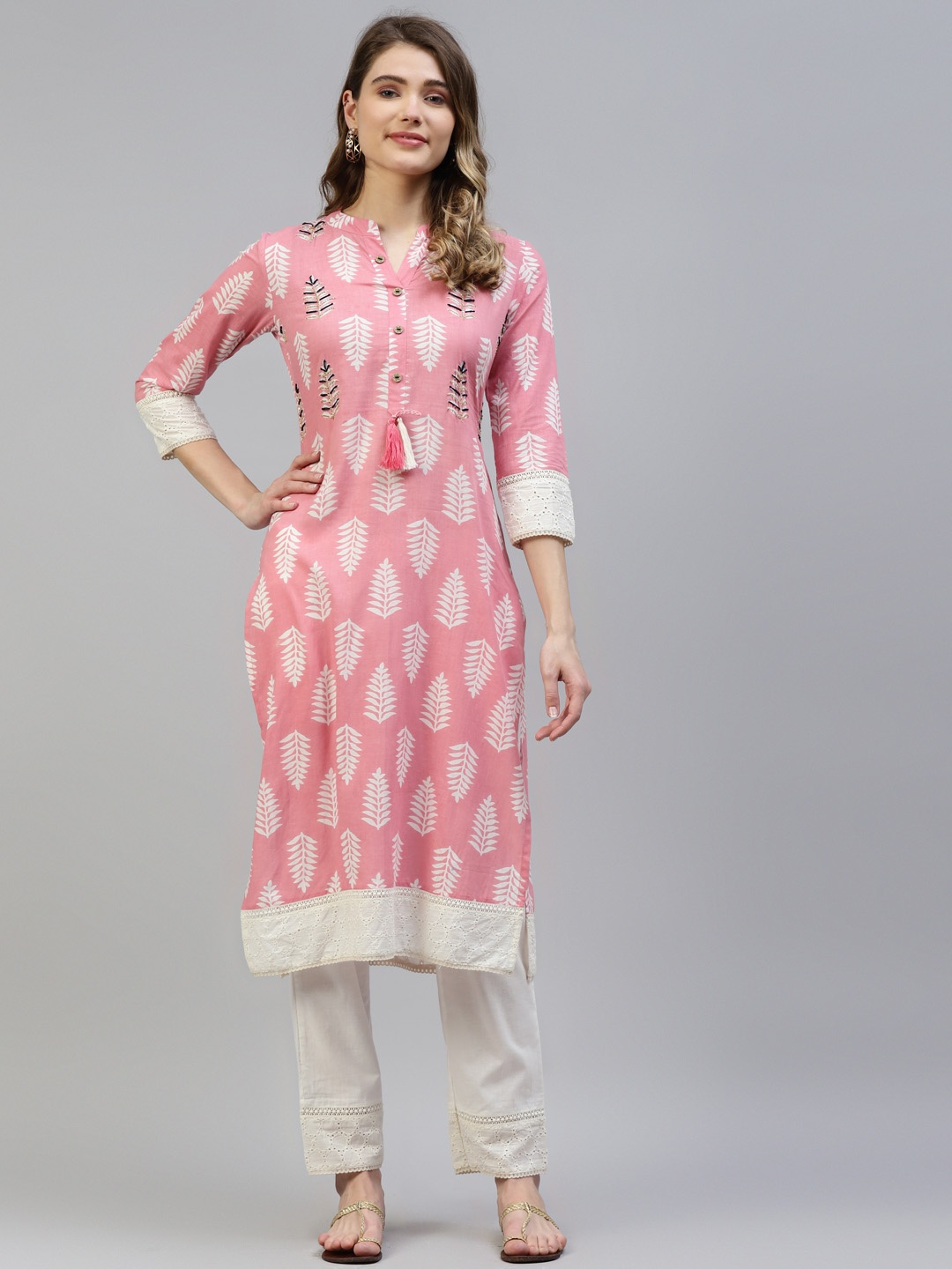 

MYAZA Women Peach-Coloured Pure Cotton Floral Print Beads and Stones Kurta with Trousers