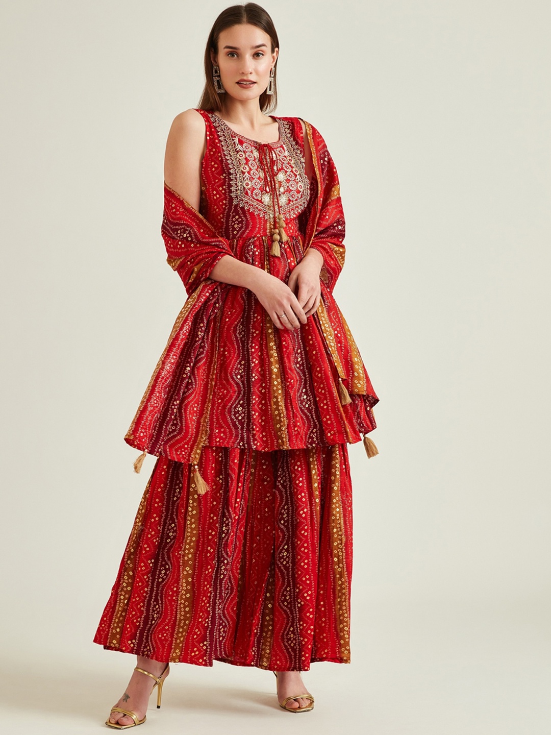

Neerus Women Red & Yellow Ethnic Motifs Pleated Aari Work Kurta with Sharara & Dupatta