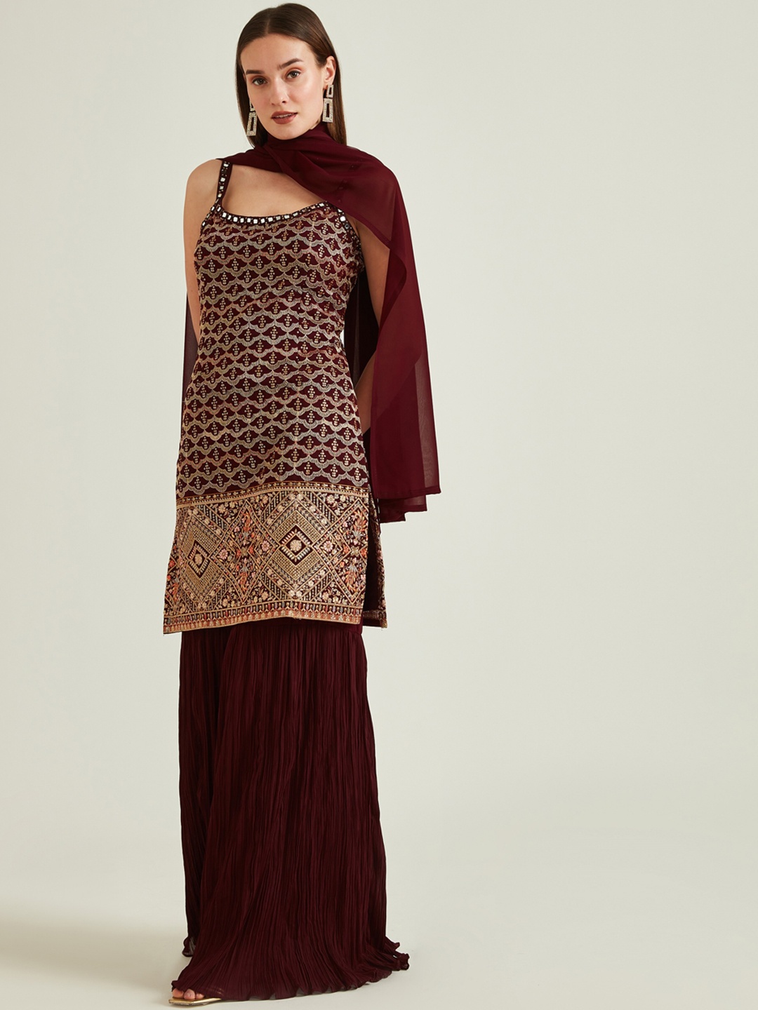 

Neerus Women Burgundy & Golden Embroidered Sequinned Kurta with Sharara & Dupatta