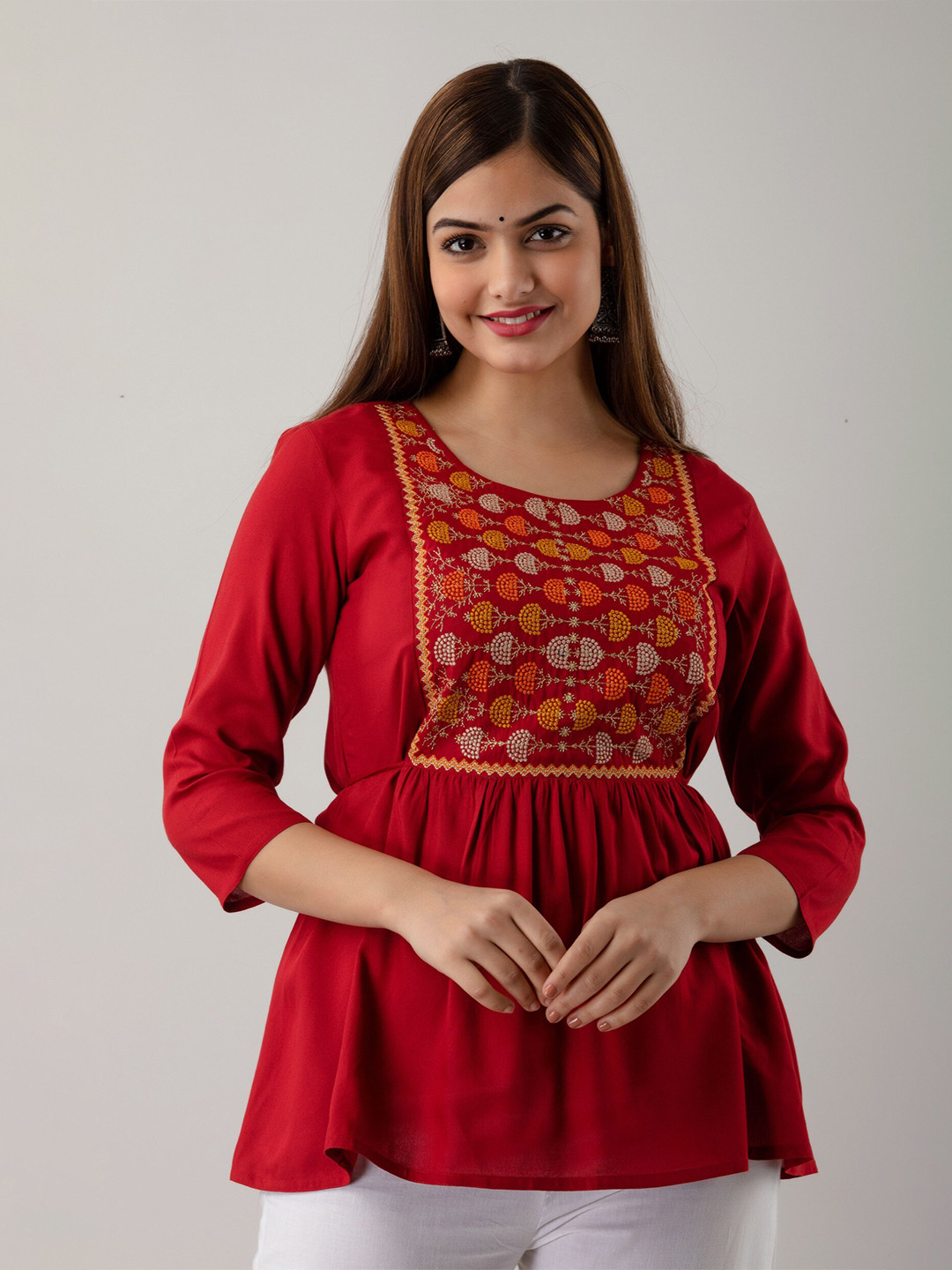 

Women Touch Women Maroon & Mustard Yellow Embroidered Empire Top