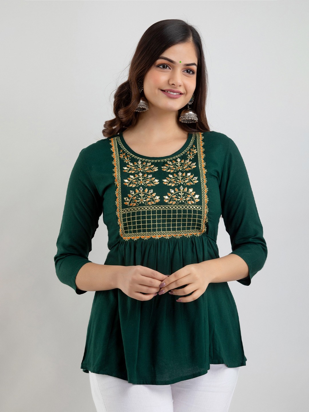 

Women Touch Women Green Embroidered Peplum Top