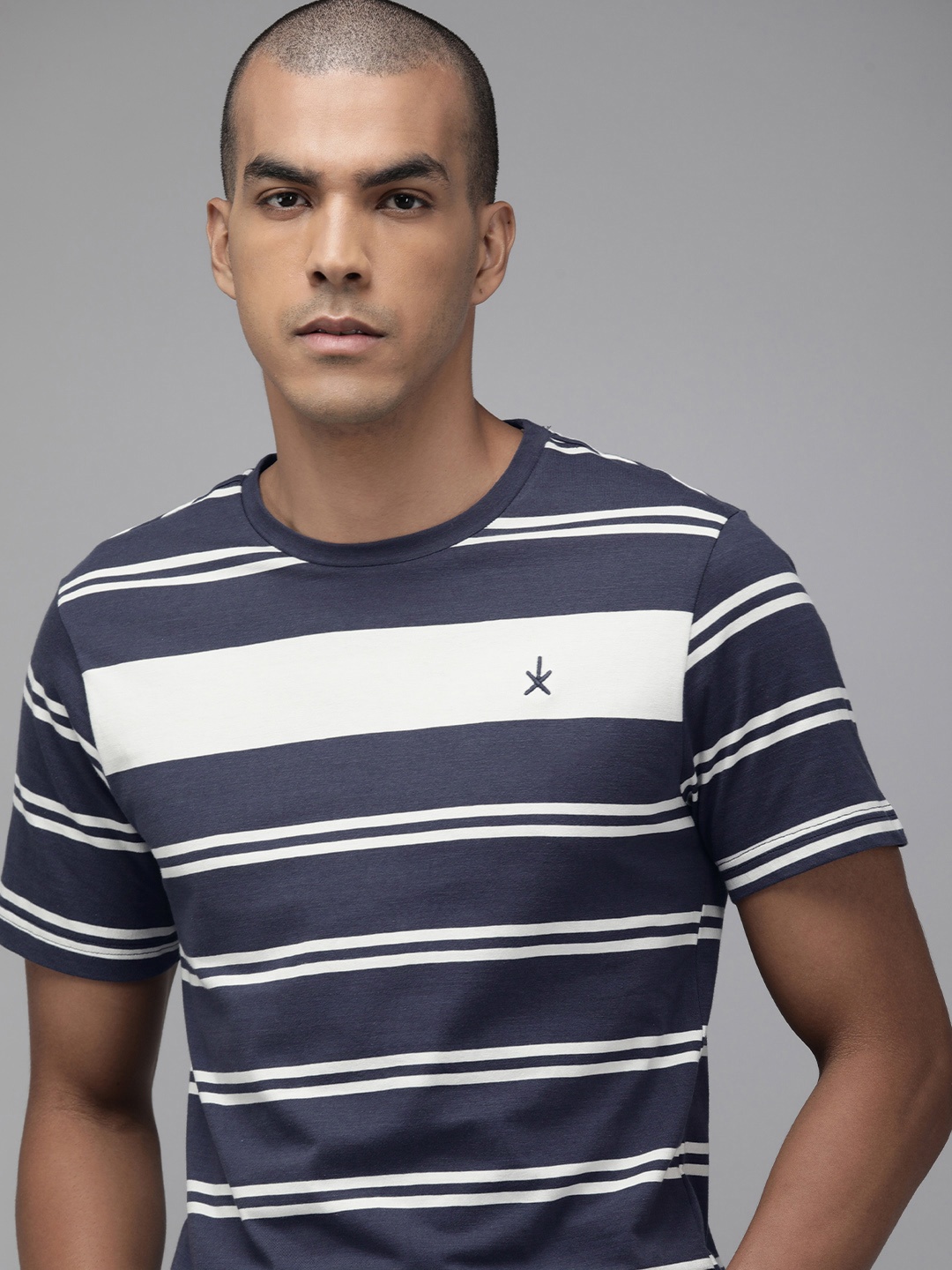 

The Roadster Lifestyle Co Men Navy Blue & White Striped Pure Cotton T-shirt
