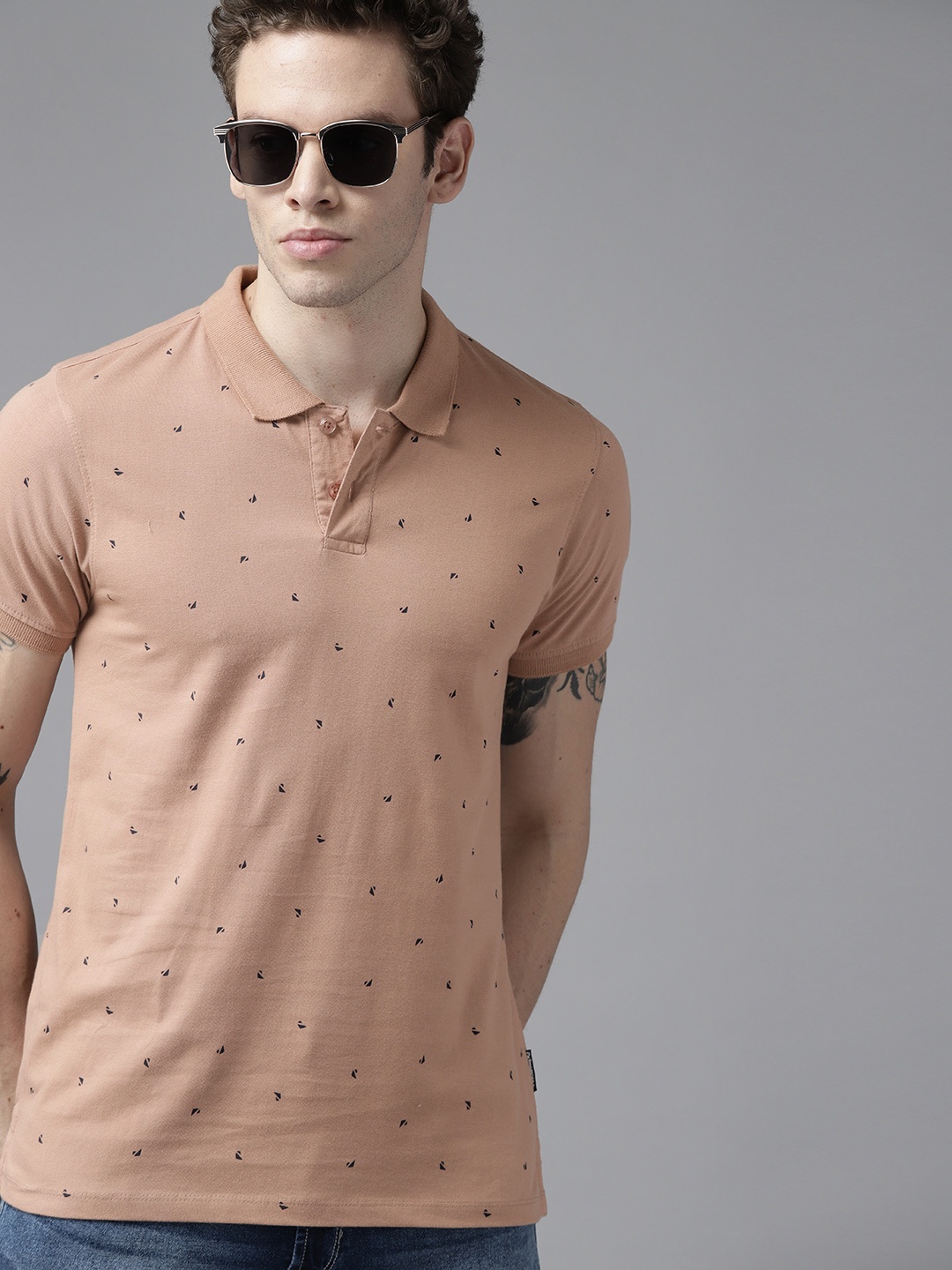 

Roadster Men Beige & Black Geometric Printed Polo Collar Pure Cotton T-shirt