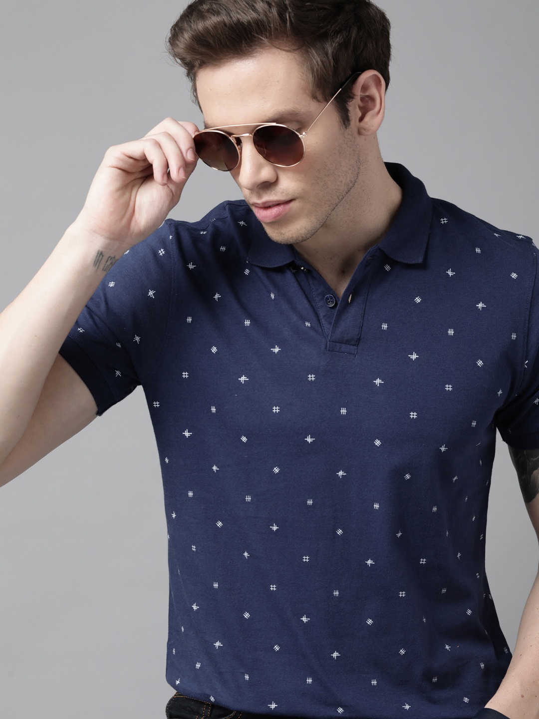 

Roadster Men Navy Blue & White Printed Polo Collar Pure Cotton T-shirt