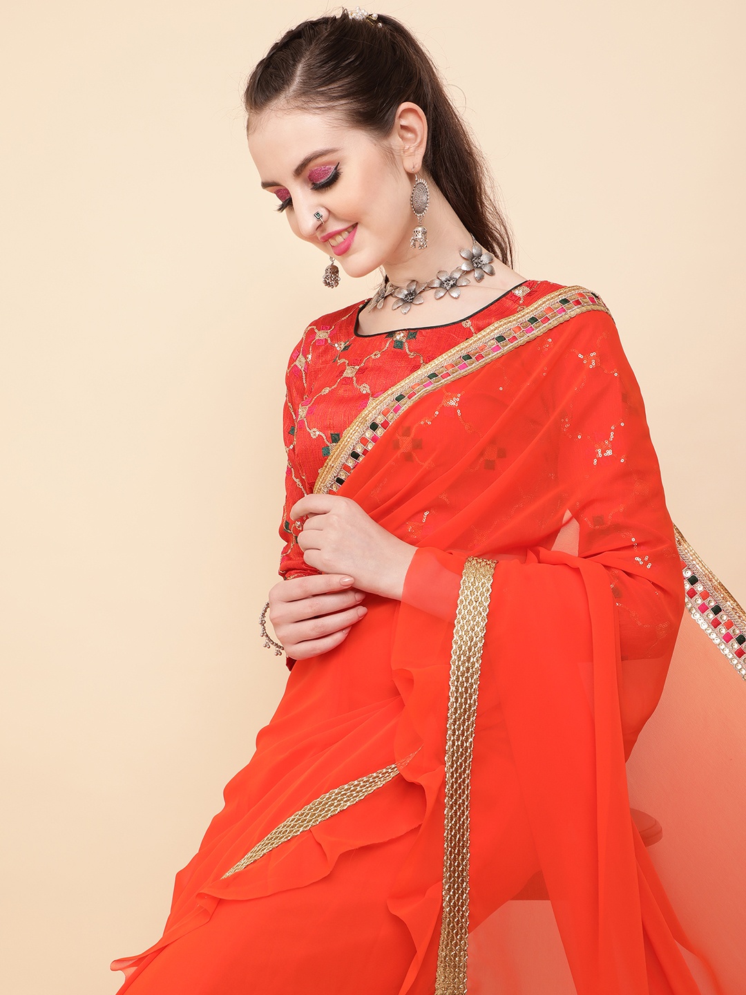 

Sangria Orange Embellished Kutchi Embroidery Pure Georgette Saree