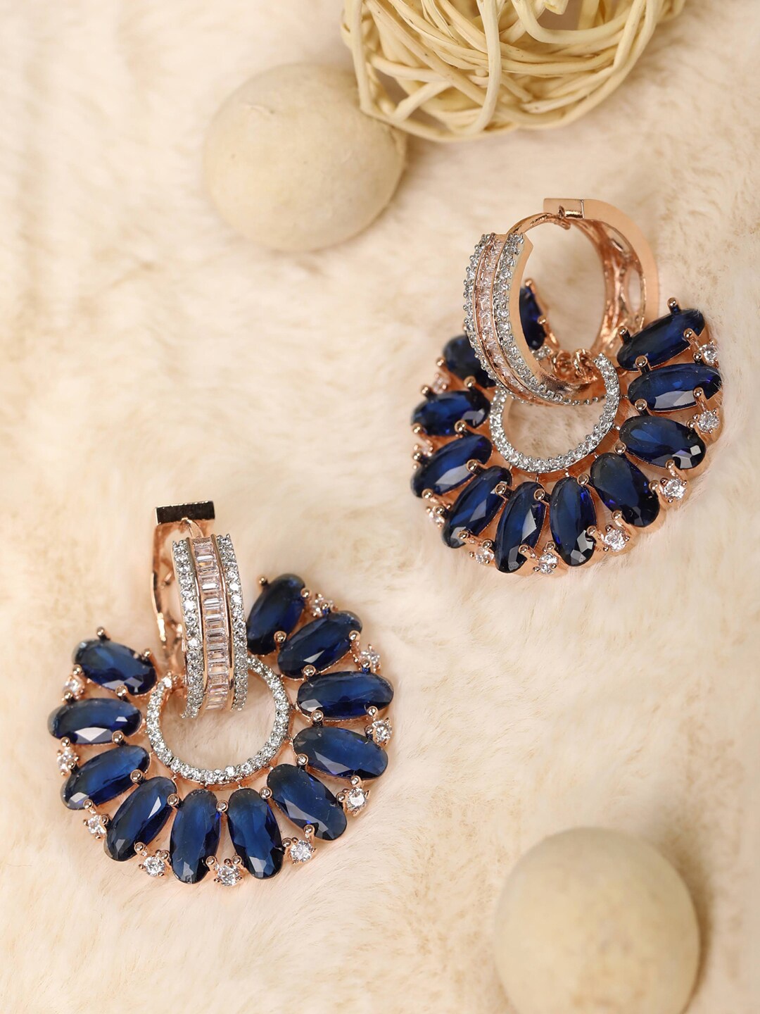 

Priyaasi Blue Floral American Diamond Studded Studs Earrings