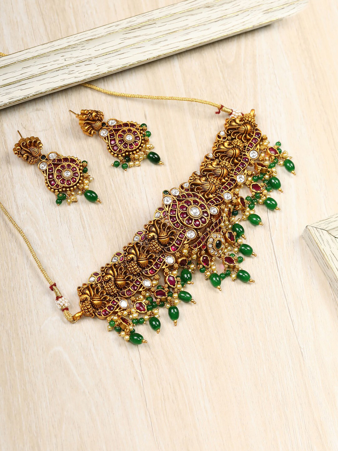 

Priyaasi Gold-Plated Green Pearls Beads Ruby Stones Peacock Choker Jewellery Set
