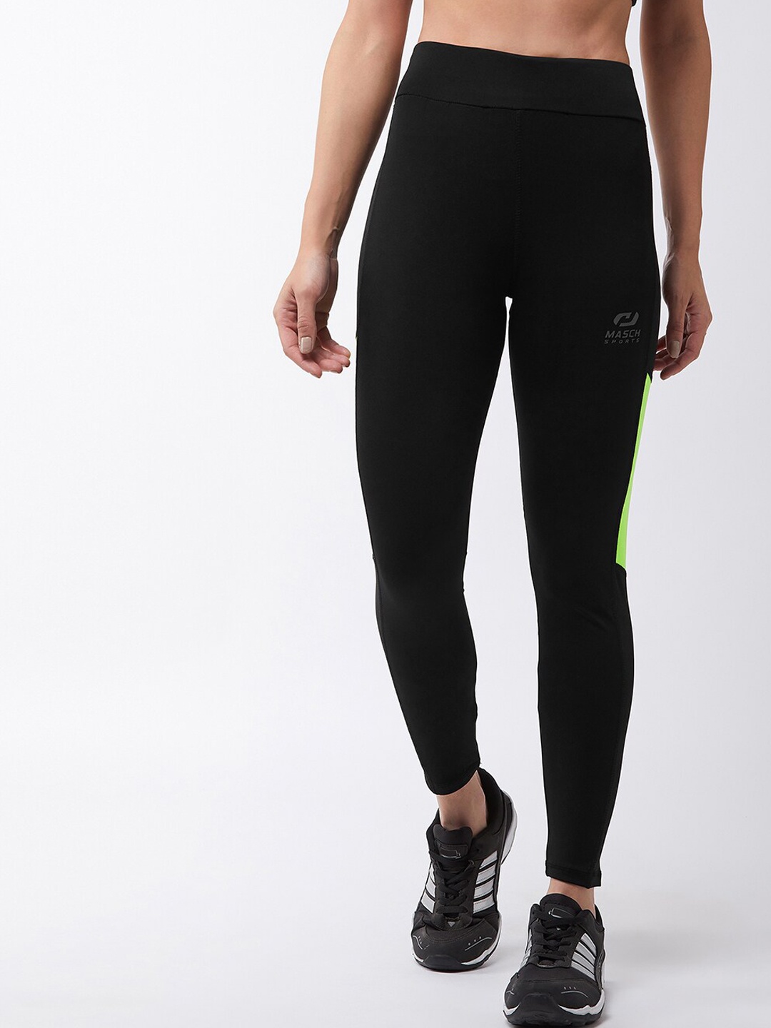 

Masch Sports Women Black & Fluorescent Green Colourblocked Dry-Fit Tights