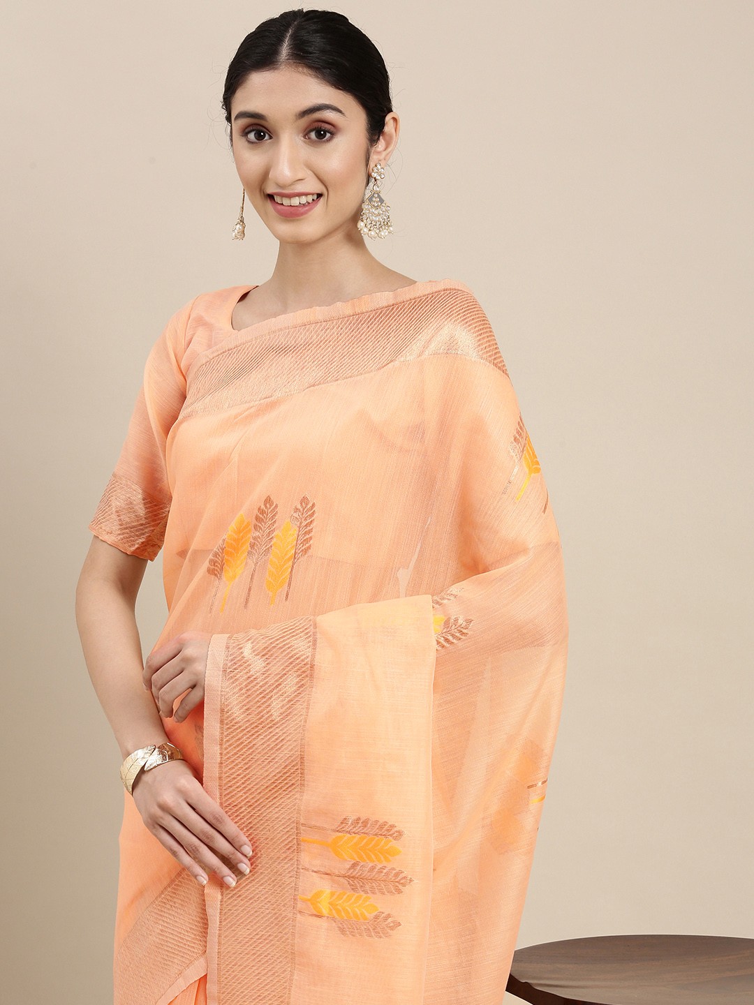 

Mitera Peach-Coloured & Golden Ethnic Design Linen Blend Banarasi Saree