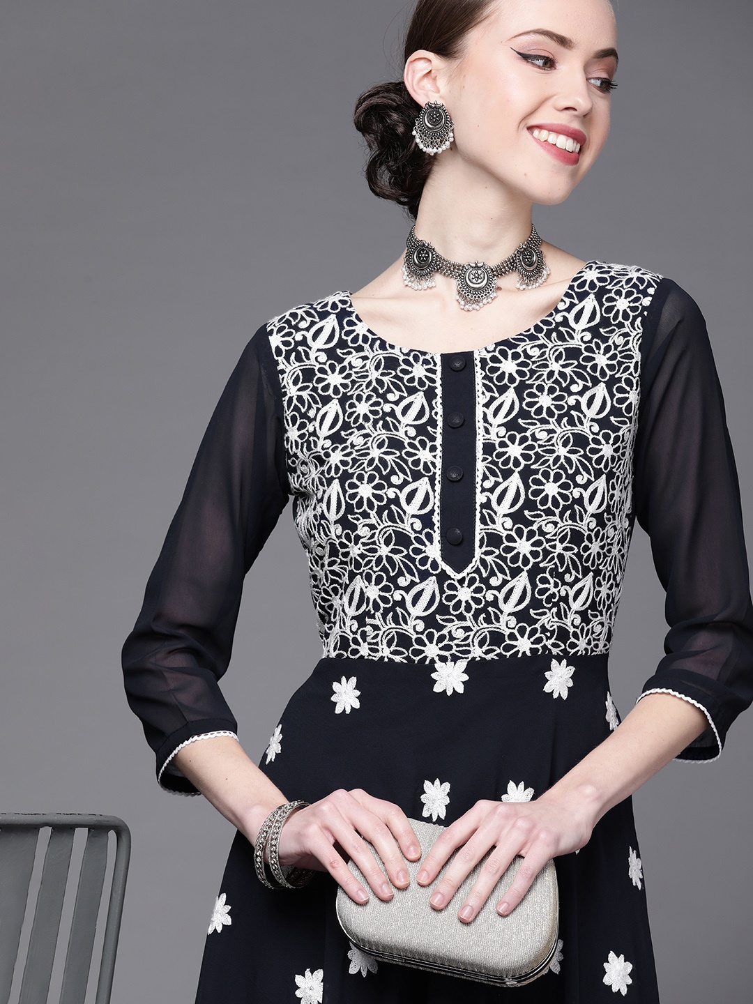 

Inddus Women Navy Blue & White Embroidered Thread Work Georgette Kurta