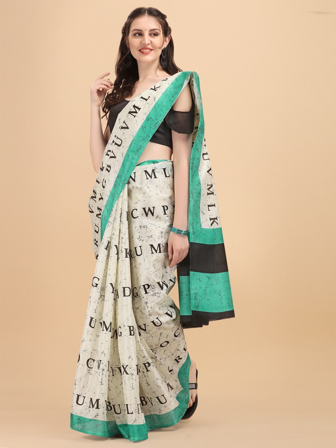 

KALINI Off White & Green Alphabet Printed Art Silk Khadi Saree
