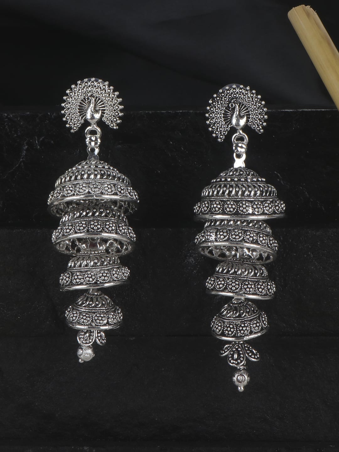 

ANIKAS CREATION Silver-Plated Peacock Shaped Jhumkas Earrings