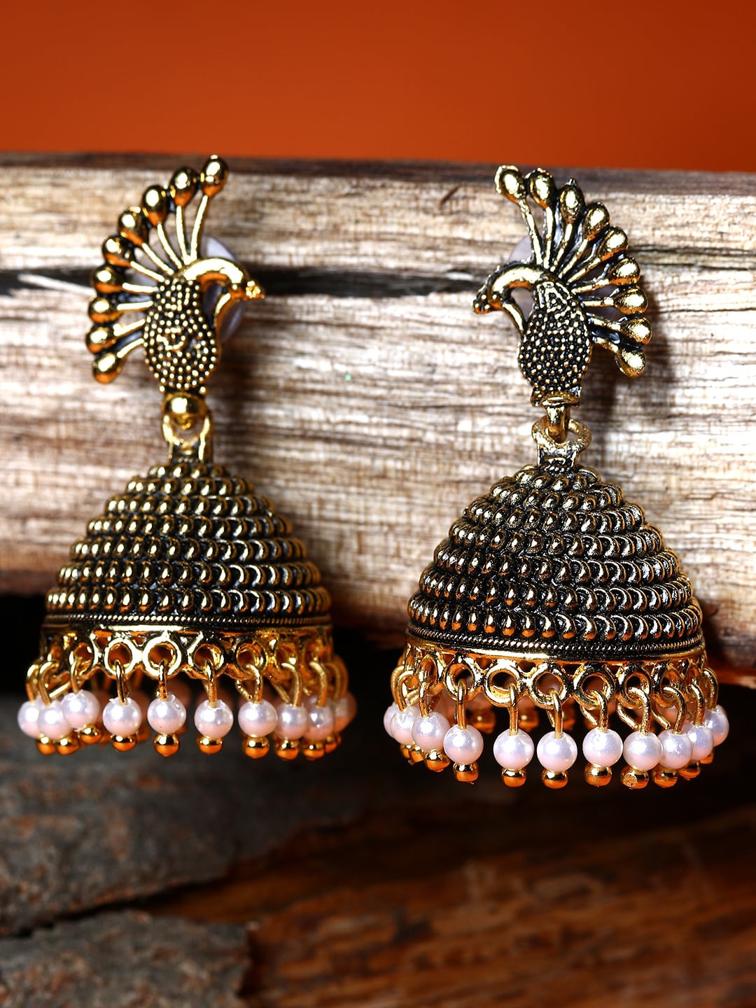 

ANIKAS CREATION Gold-Toned Peacock Shaped Jhumkas