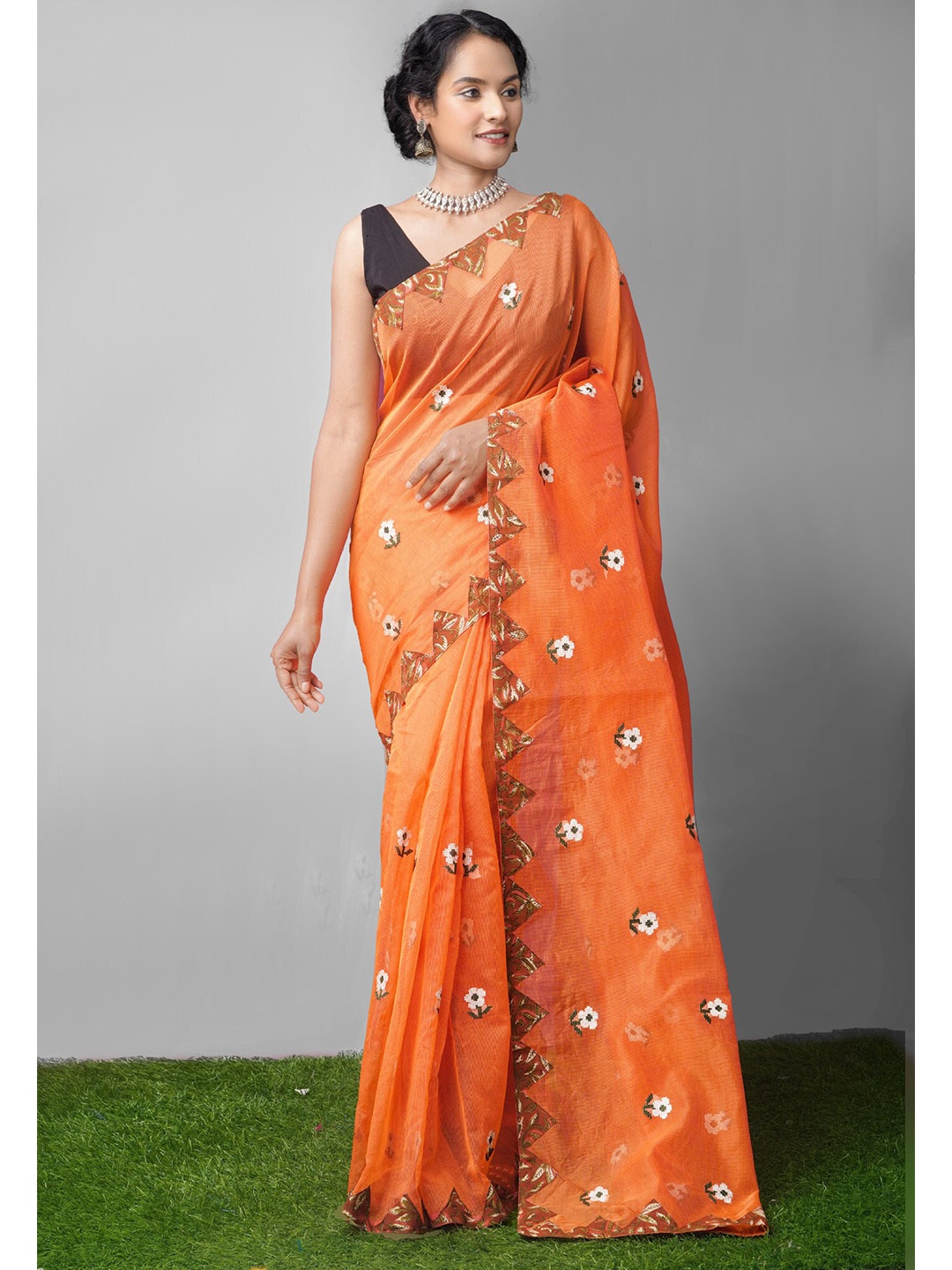 

Unnati Silks Orange Floral Patchwork Net Patola Saree