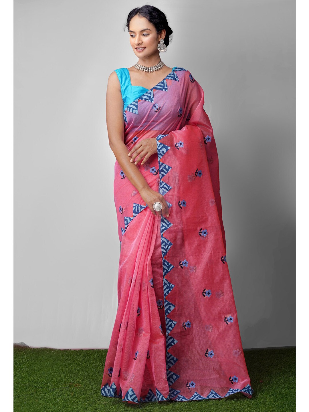 

Unnati Silks Pink & Blue Floral Cross Stitched Embroidered Net Patola Saree