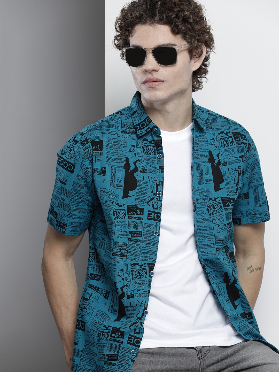 

The Indian Garage Co Men Teal Regular Fit Newspaper Printed Resortwear Shirt